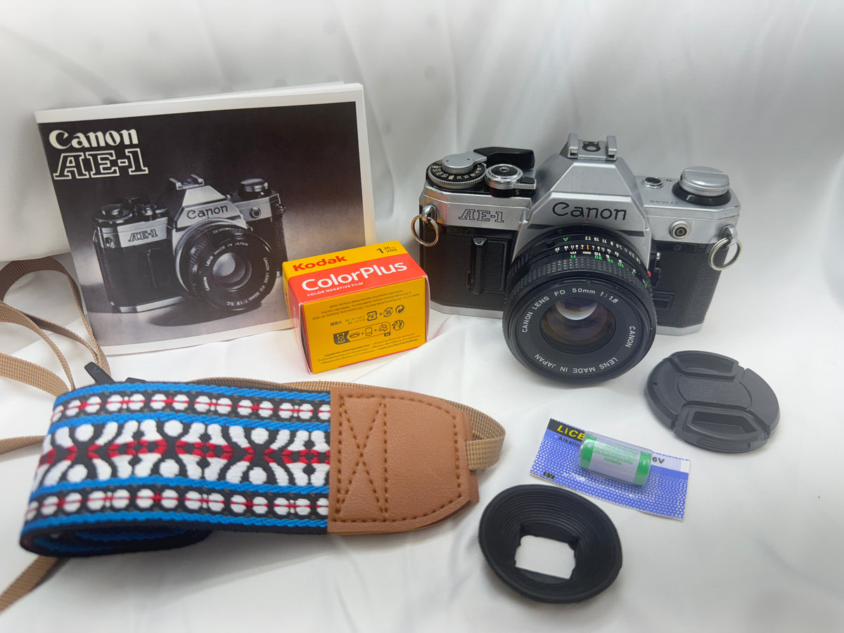 Canon AE1 35mm Film Camera SLR w/ battery, film, manual